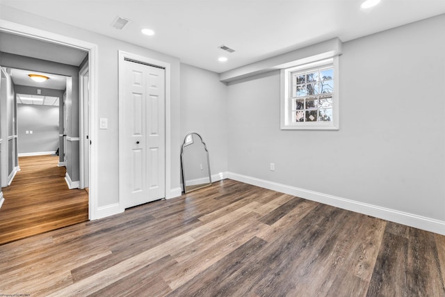 empty room featuring wood-type flooring