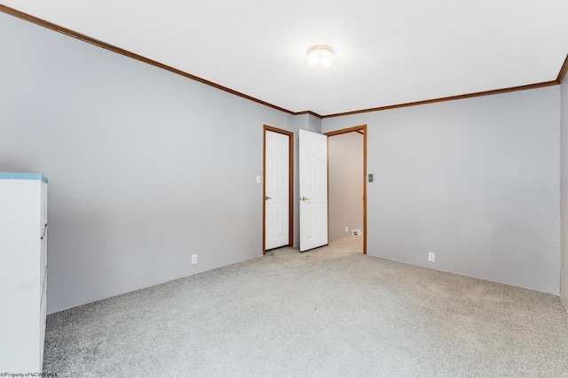 empty room with light carpet and ornamental molding