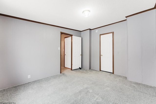 unfurnished room featuring light carpet