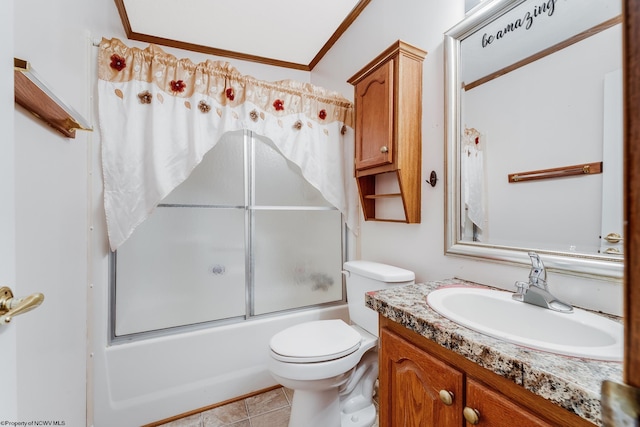 full bathroom featuring bath / shower combo with glass door, vanity, toilet, crown molding, and tile patterned floors