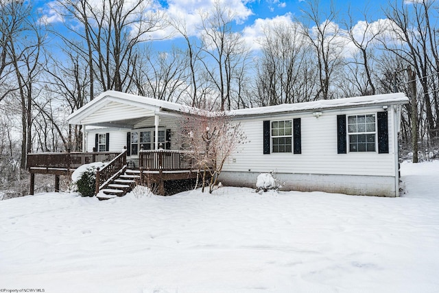 manufactured / mobile home featuring covered porch