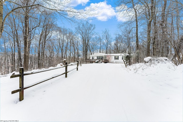 view of yard layered in snow