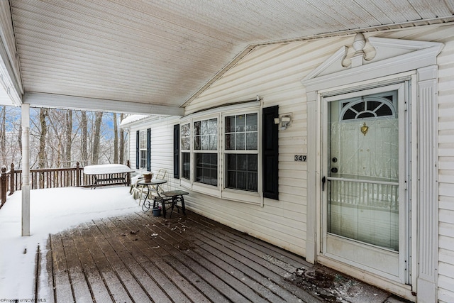 view of snow covered deck