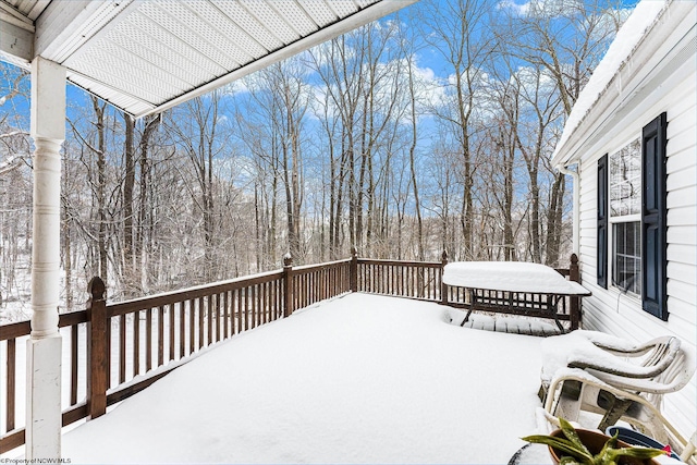 view of snow covered deck