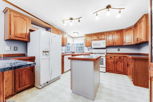 kitchen with white appliances and a kitchen island