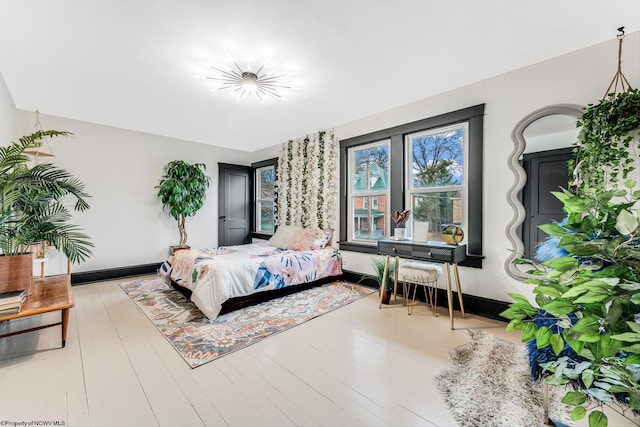 bedroom with hardwood / wood-style flooring