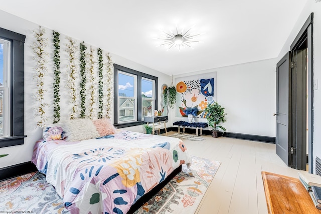 bedroom with light hardwood / wood-style flooring