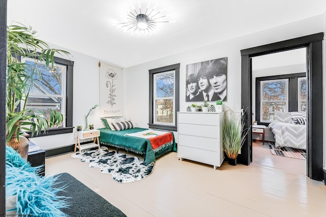 bedroom featuring wood-type flooring