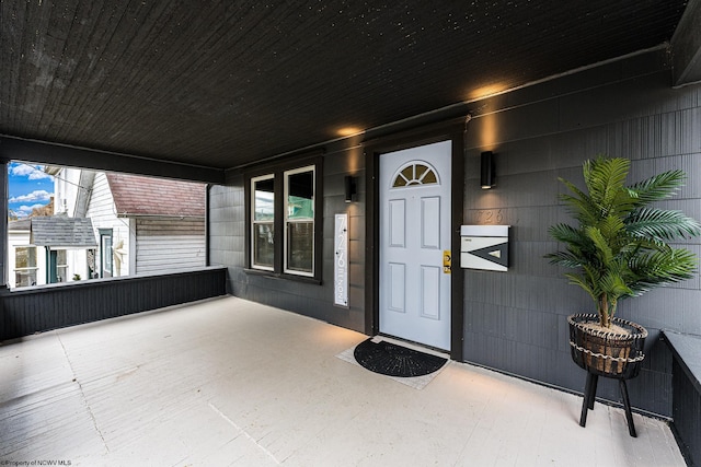 doorway to property featuring a porch