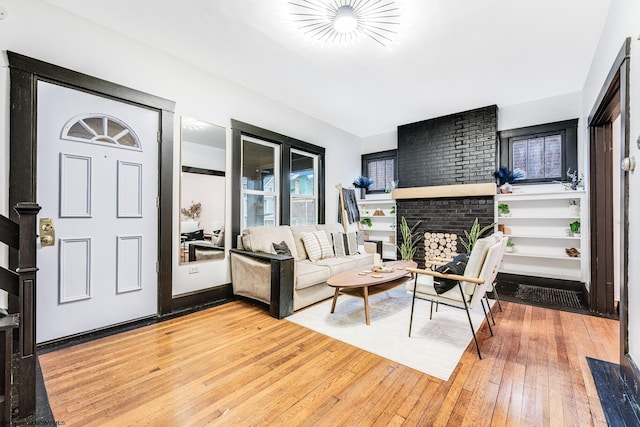 interior space with a fireplace and light hardwood / wood-style floors