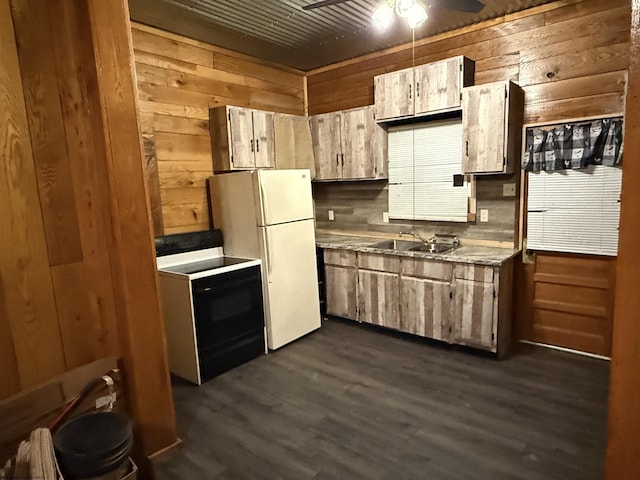 kitchen with ceiling fan, wooden walls, sink, and electric range oven