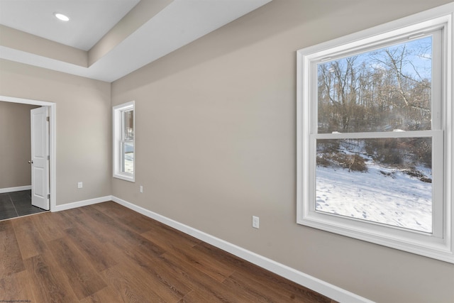 unfurnished bedroom featuring dark hardwood / wood-style floors