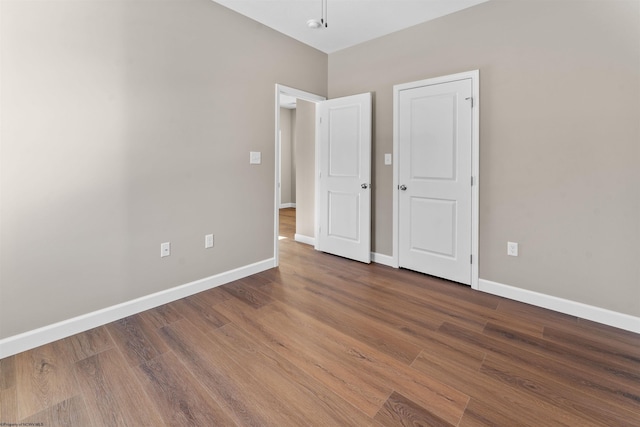 unfurnished bedroom featuring hardwood / wood-style floors