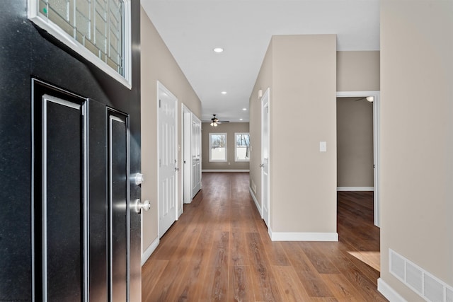 hallway featuring wood-type flooring