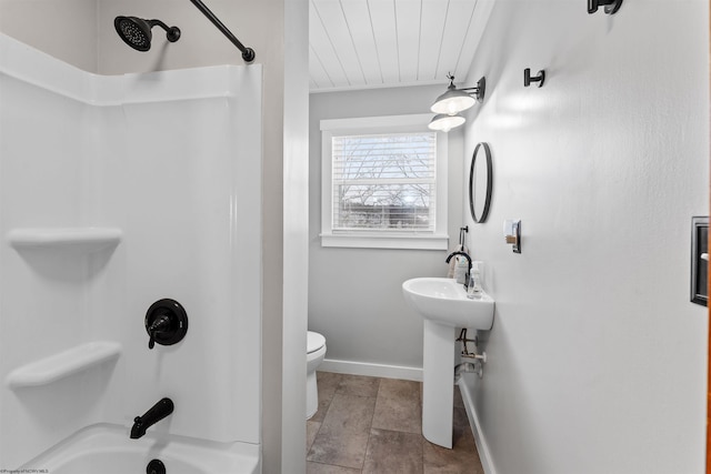 bathroom featuring  shower combination and toilet