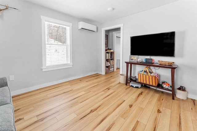 living room with hardwood / wood-style floors and a wall mounted AC