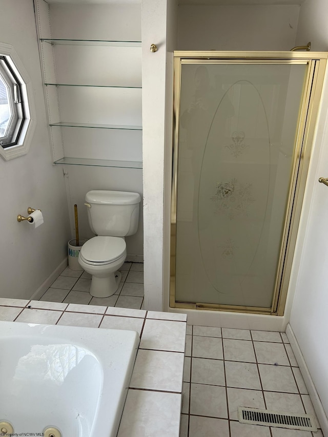 bathroom with toilet, tile patterned flooring, and a shower with door