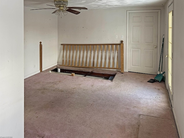 unfurnished room featuring carpet floors and ceiling fan