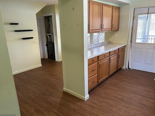 kitchen with dark wood-type flooring