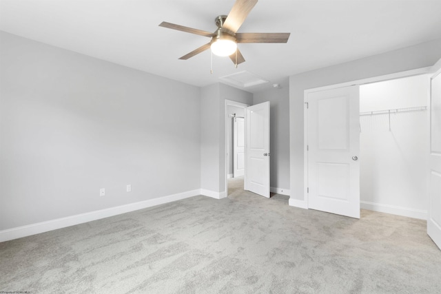 unfurnished bedroom with light carpet, a closet, and ceiling fan