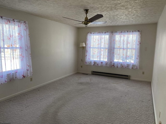 spare room with baseboard heating, ceiling fan, light carpet, and a textured ceiling