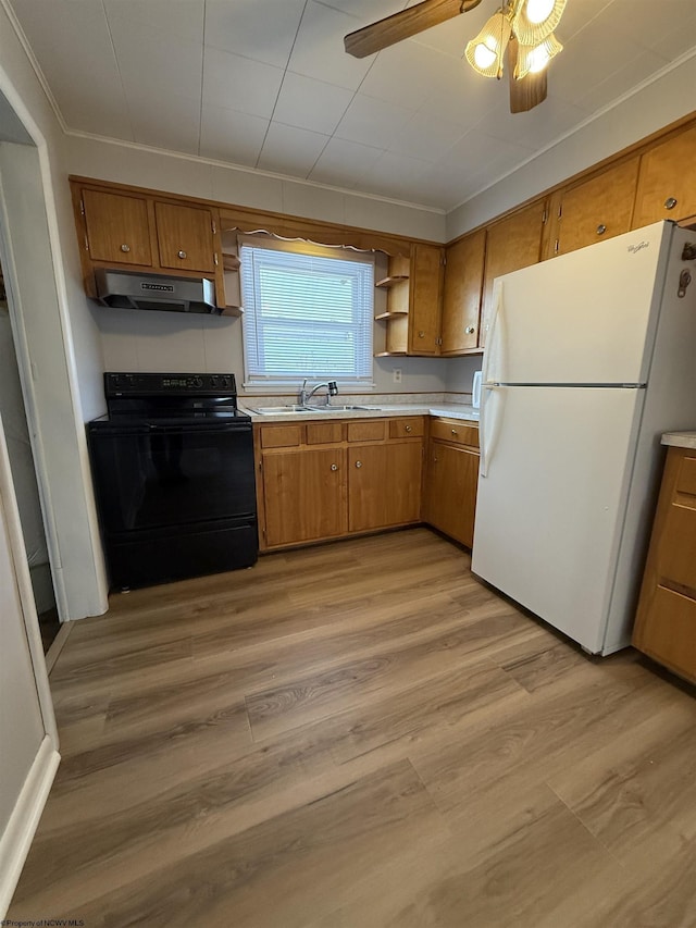 kitchen featuring sink, white fridge, ceiling fan, black range with electric stovetop, and light wood-type flooring