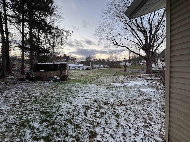 view of yard layered in snow