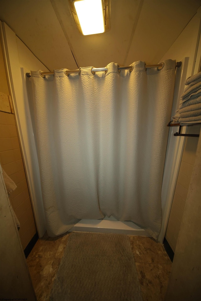 bathroom with a shower with shower curtain