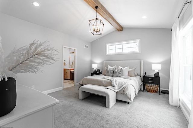 carpeted bedroom featuring an inviting chandelier, ensuite bathroom, and lofted ceiling with beams