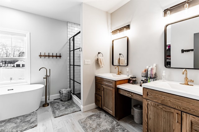 bathroom featuring independent shower and bath and vanity