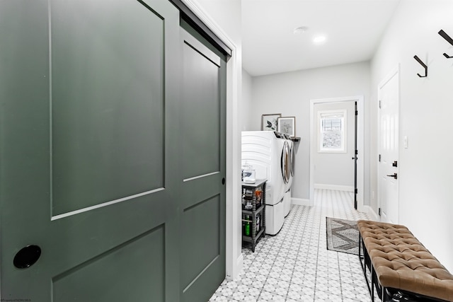 laundry area featuring washing machine and clothes dryer