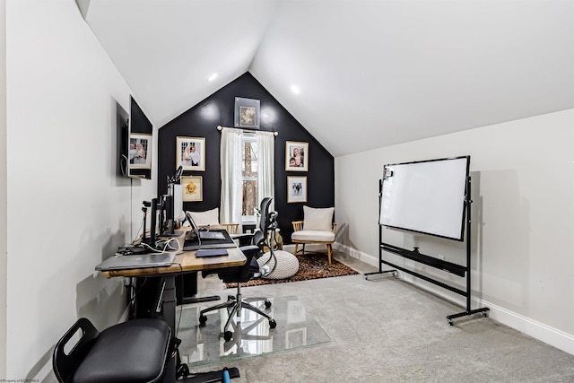 carpeted office space featuring lofted ceiling