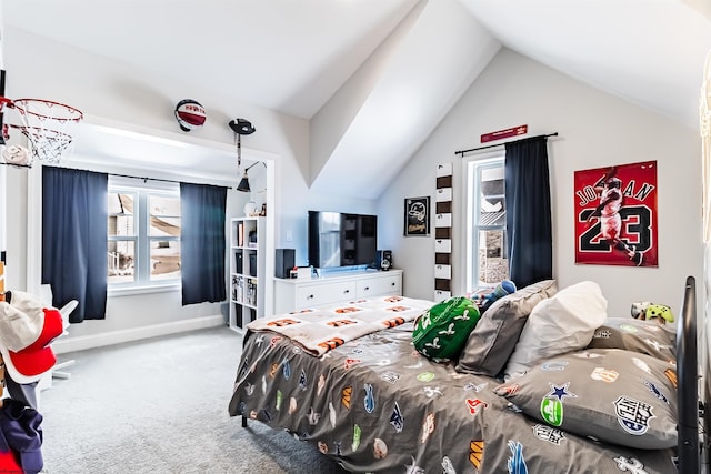 carpeted bedroom with lofted ceiling