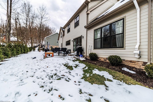 view of snow covered property