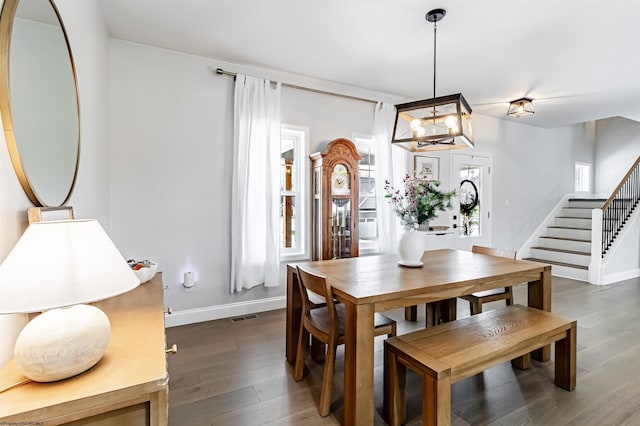 dining space featuring dark hardwood / wood-style floors