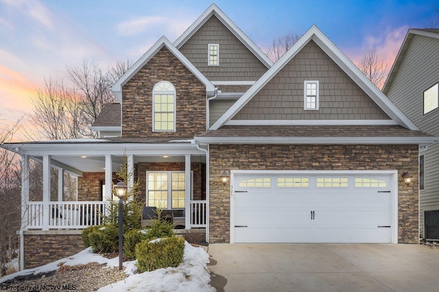 craftsman house featuring a garage and covered porch