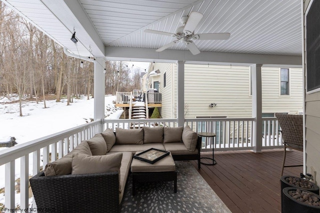 snow covered deck with an outdoor hangout area and ceiling fan