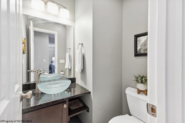 bathroom with vanity and toilet