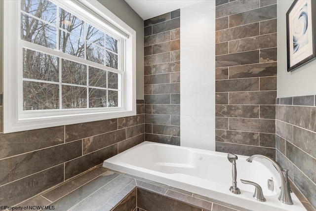 bathroom with tiled bath