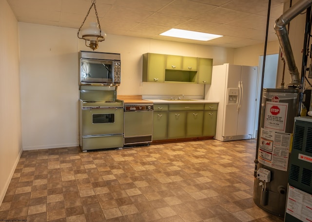 kitchen featuring dishwasher, green cabinets, white fridge with ice dispenser, range with electric cooktop, and water heater