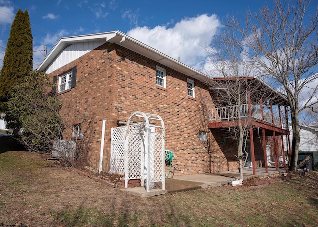 back of property with a patio area and a lawn