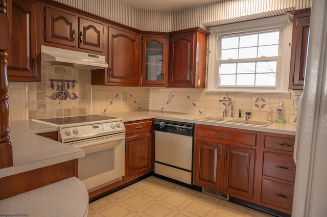 kitchen with dishwasher, sink, white electric range oven, and backsplash