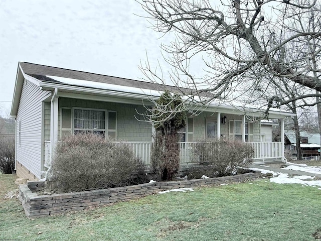 view of front of house featuring a front yard and a porch