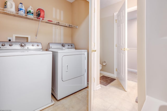 washroom with separate washer and dryer