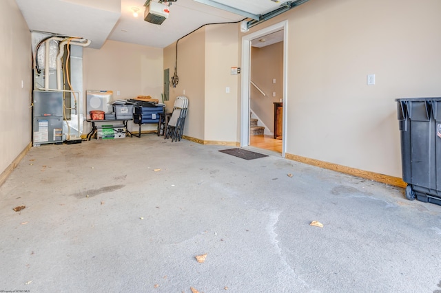 garage with a garage door opener and heating unit