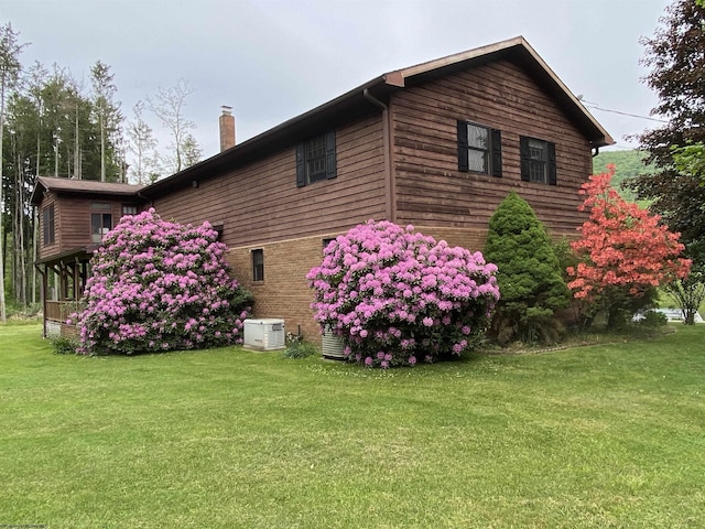 view of property exterior featuring a yard