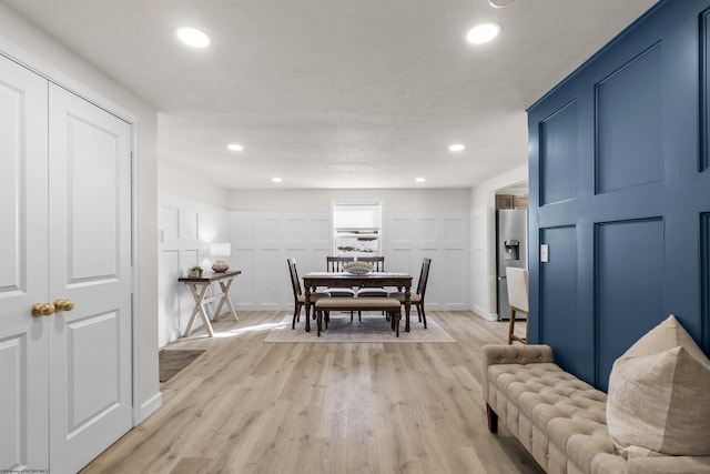 dining space with light wood-type flooring