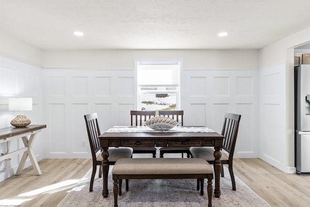 dining space with light wood-type flooring