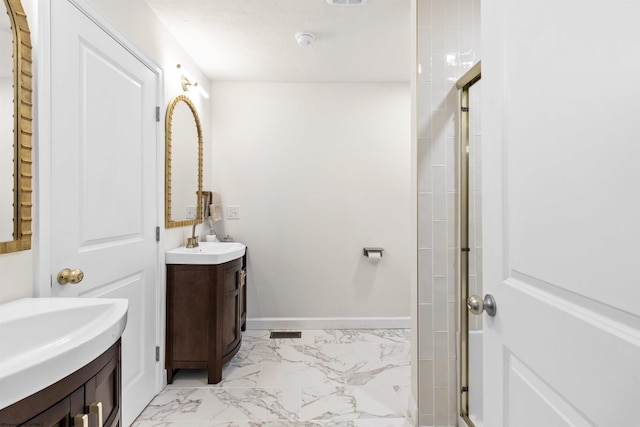 bathroom featuring vanity and a shower with door