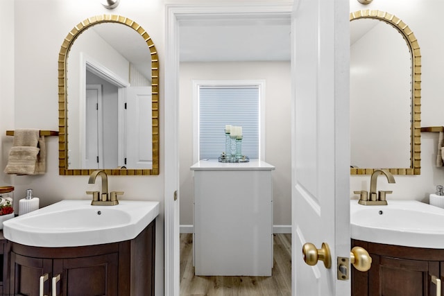 bathroom featuring vanity and wood-type flooring